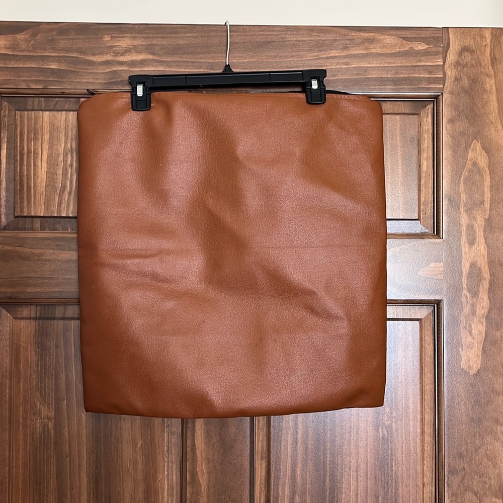 Woven Nook faux leather pillow cover.